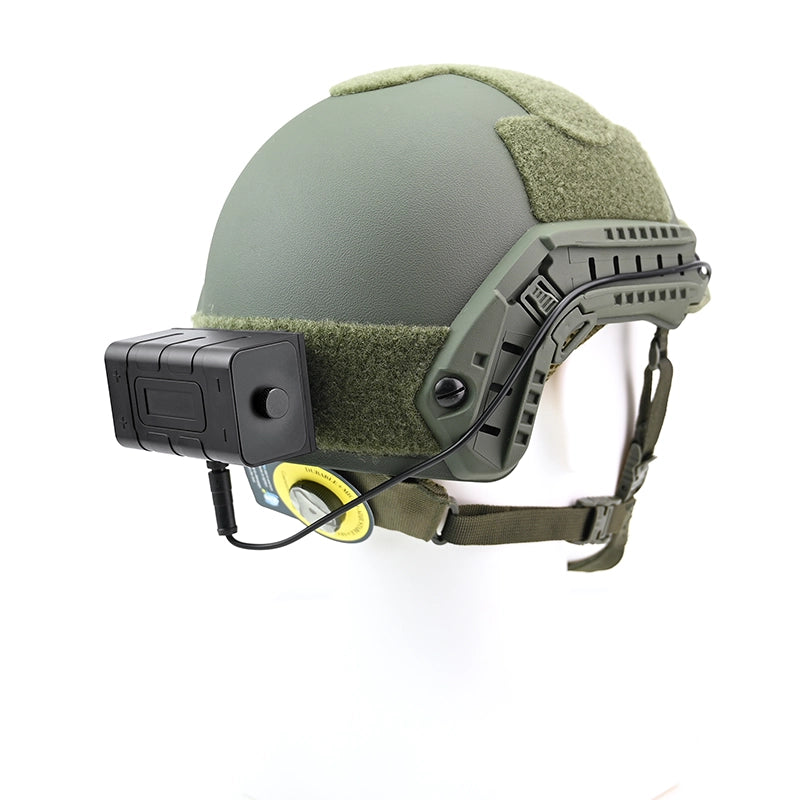 Green tactical helmet with night vision battery pack on a white background