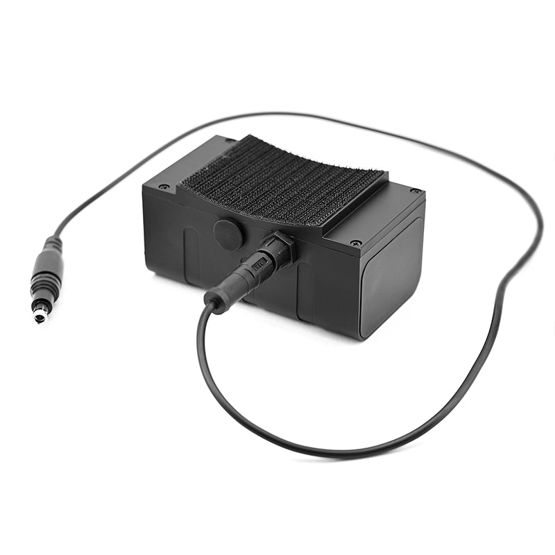 Black night vision battery pack on a white background